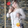 Breeder holding Bonnie and Clyde Mini Chihuahua puppies in a handbag
