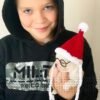 Creed white short hair Chihuahua puppy with Santa hat held by Brandon