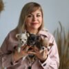 Breeder holding Luna Bonnie and Clyde Teacup Chihuahua puppies together