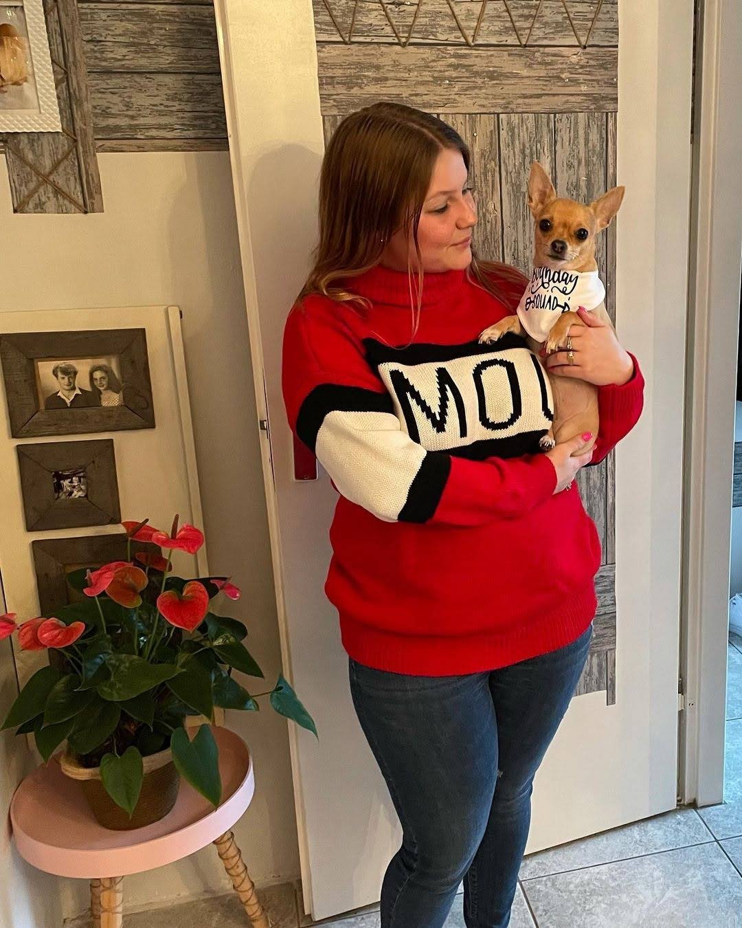 Happy woman holding her male Chihuahua puppy from ChihuahuaHub.shop